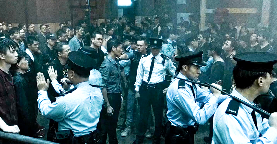 A scene of men and police officers confronting each other.