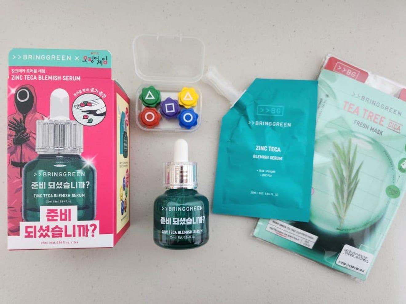ของที่ระลึกจากการร่วมมือกันระหว่างเกมイカゲーム (Squid Game) และแบรนด์ Bring Green ที่ Olive Young